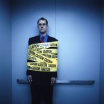 Businessman Wrapped in Caution Tape 2002